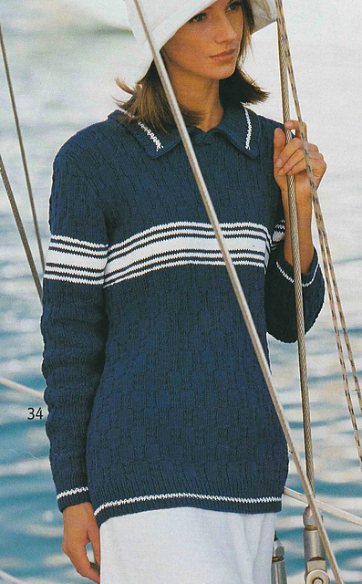 # 34 Pull bleu au point de relief