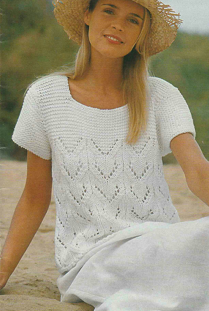 # 26 Pull blanc à motif ajouré