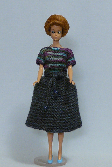 Crocheted Blouse and Striped Skirt