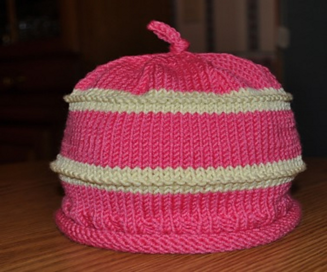 Ravelry Striped Top Knot Baby Hat pattern by Nancy Wynn