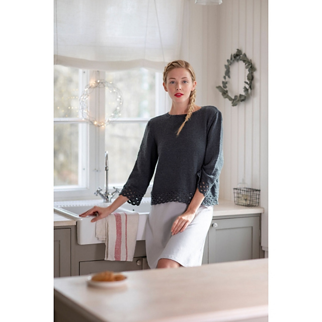 Women's knitted sweater with lace borders