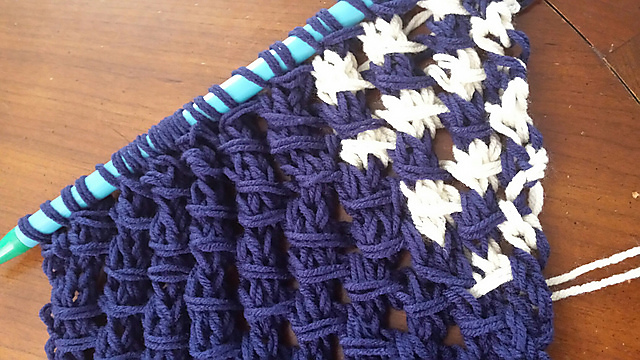 Open Knit Stitch Shawl of a triangular shape