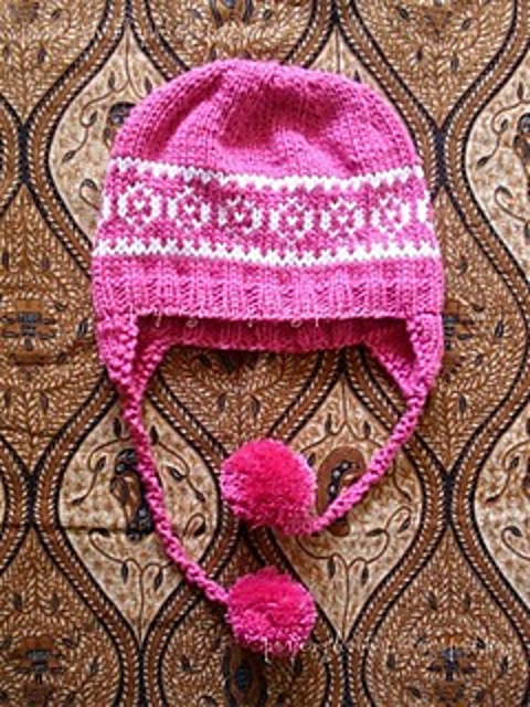 Earflap hat with motive