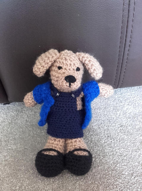 little dog with pinafore