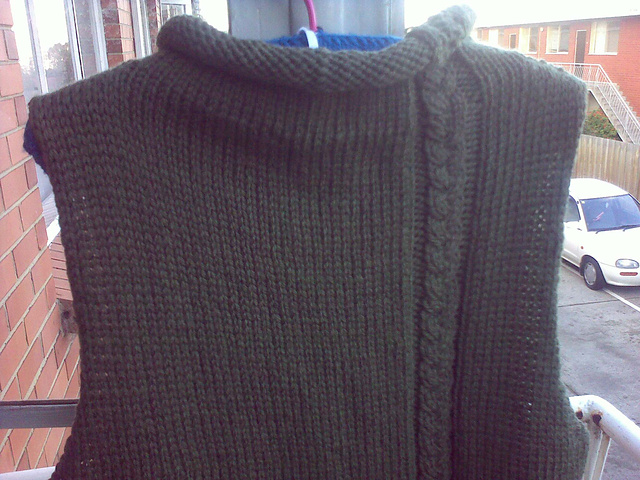 Sleeveless tunic with cable braid feature