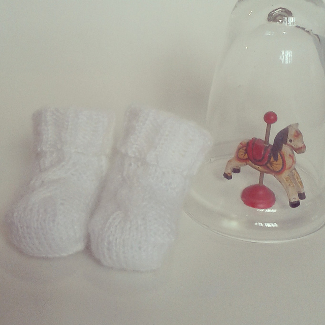 Baby booties with cable detail