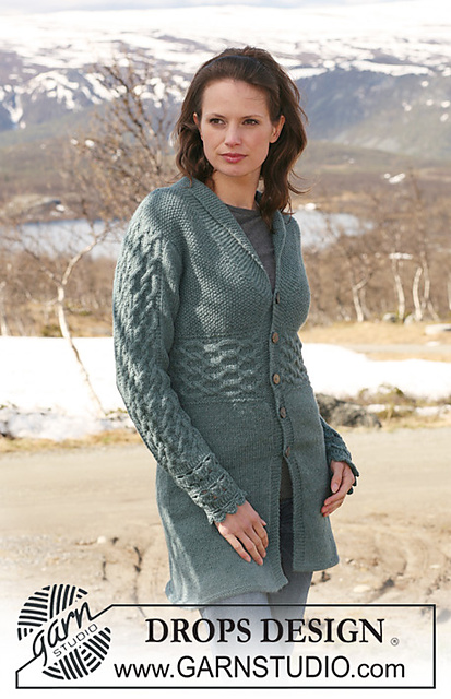 115-23 Long jacket with cables and crochet cuffs